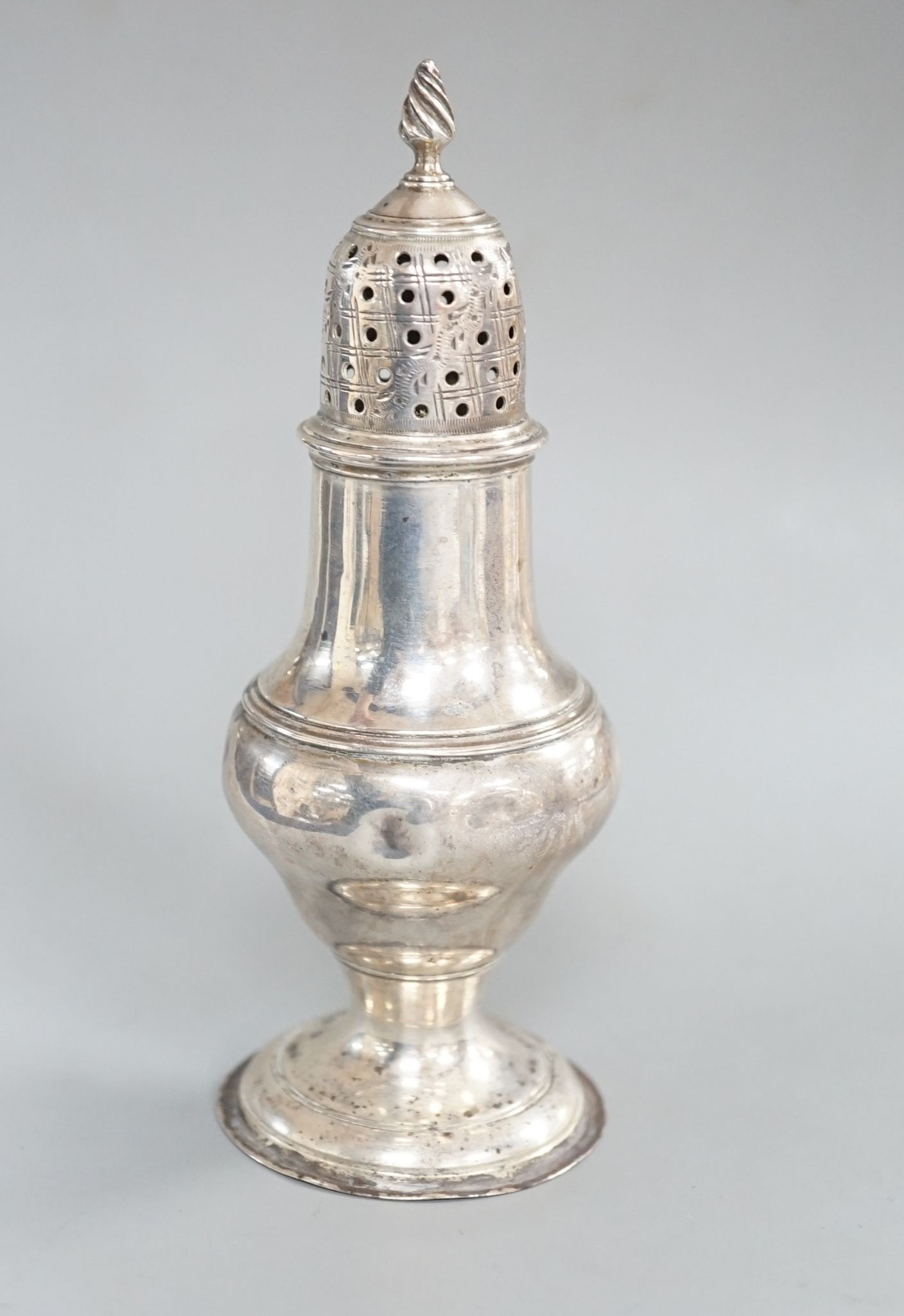 A George III silver baluster pepperette, Thomas Daniell, London, 1783, 13.2cm, 74 grams.